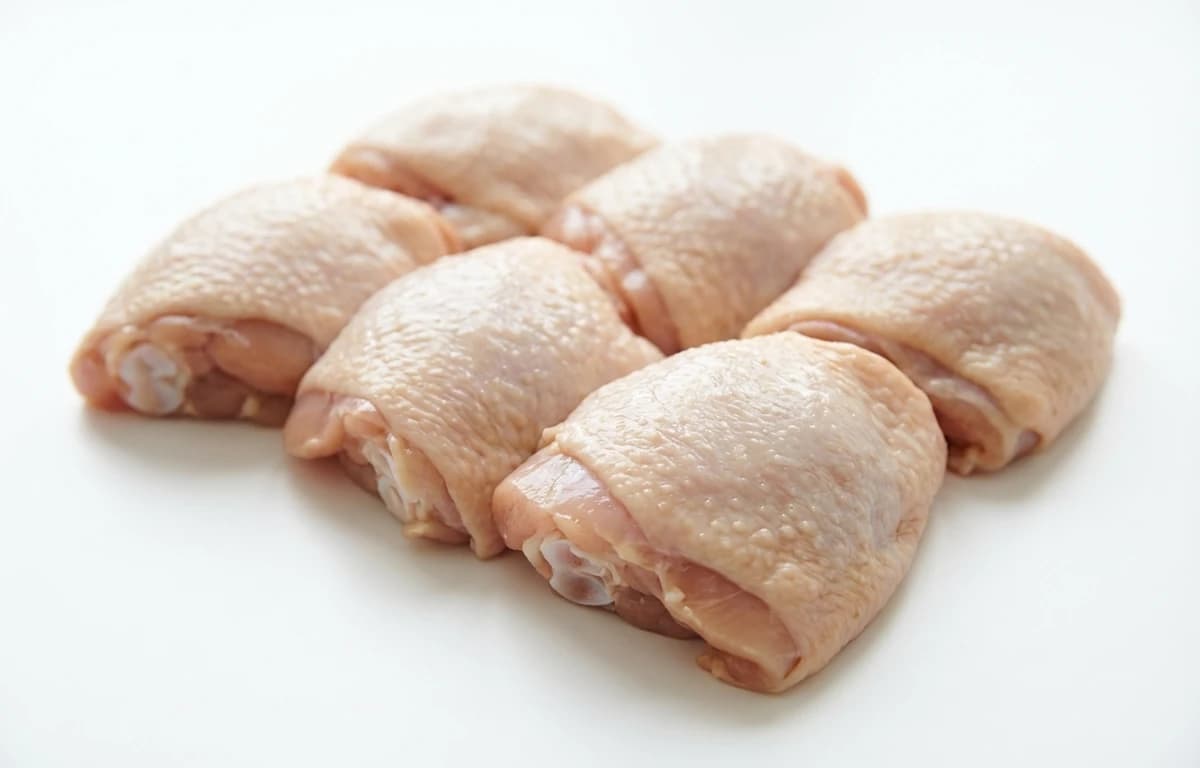 raw chicken dark meat with skin